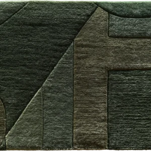 A luxury designer rug with raised, textured geometric patterns in deep green tones.