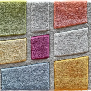 Luxury designer carpet tiles in yellow, green, pink, orange, blue, and gray form a vibrant high-end rug grid.