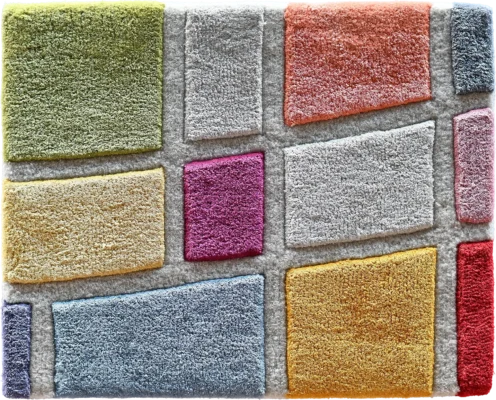 Luxury designer carpet tiles in yellow, green, pink, orange, blue, and gray form a vibrant high-end rug grid.