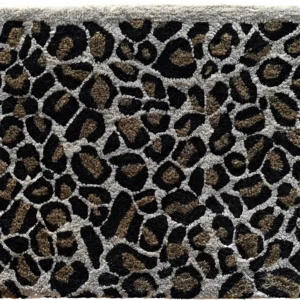 Luxury designer rug swatch with a leopard print in brown, black, and beige tones.