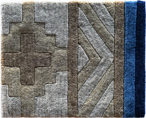 Luxury designer rug with geometric patterns in beige, brown, gray, and blue tones.