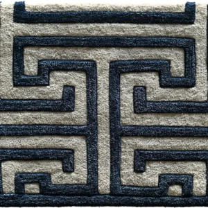 Luxury designer rug featuring a geometric dark blue pattern on a beige high-end wool background.