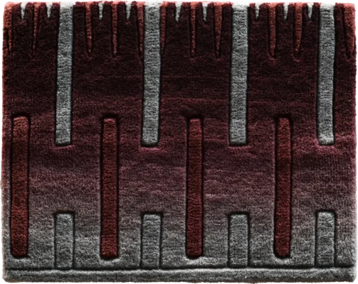 Luxury designer rug with vertical raised lines and a burgundy to gray gradient pattern.