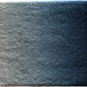 Close-up of gray textured fabric showcasing subtle lighting for luxury designer rugs.