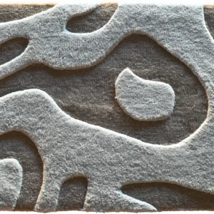 Luxury designer rug with a dark gray base and raised, abstract light gray patterns.