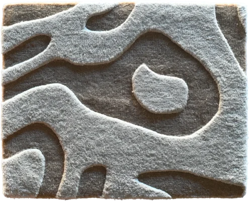 Luxury designer rug with a dark gray base and raised, abstract light gray patterns.