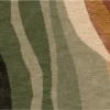 Luxury custom silk wool designer rug with wavy green, beige, and rust stripes, handmade for high end interiors.