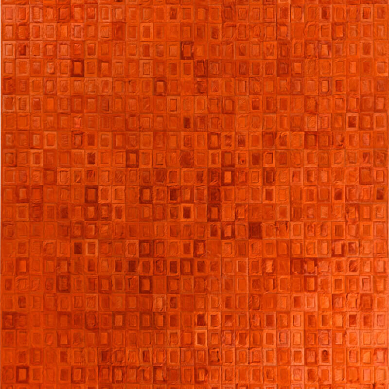 Luxury designer rug with a textured grid of raised orange squares on an orange base.