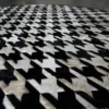 Luxury designer rug, Blackdog Hide 14697, black and white houndstooth handmade hide rug.