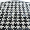 Close-up of luxury designer Blackdog Hide 14697 high-end handmade hide rug in black, white, and gray houndstooth.