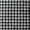 Close-up of Blackdog Hide 14697 luxury designer rug with a textured black and white houndstooth pattern.