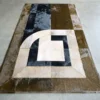 The Prisma Hide 14674 luxury designer rug showcases geometric patterns in premium hide on a light floor.