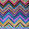 Luxury custom hide rug with vibrant chevron zigzag, ideal designer accent piece.