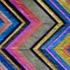 Luxury custom hide rug with colorful zigzag stripes in pink, blue, gold and silver.
