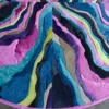 Circular luxury designer rug crafted from Submerge Hide 14897, featuring wavy handmade hide sections in blue, purple, pink, yellow, gray, and teal.