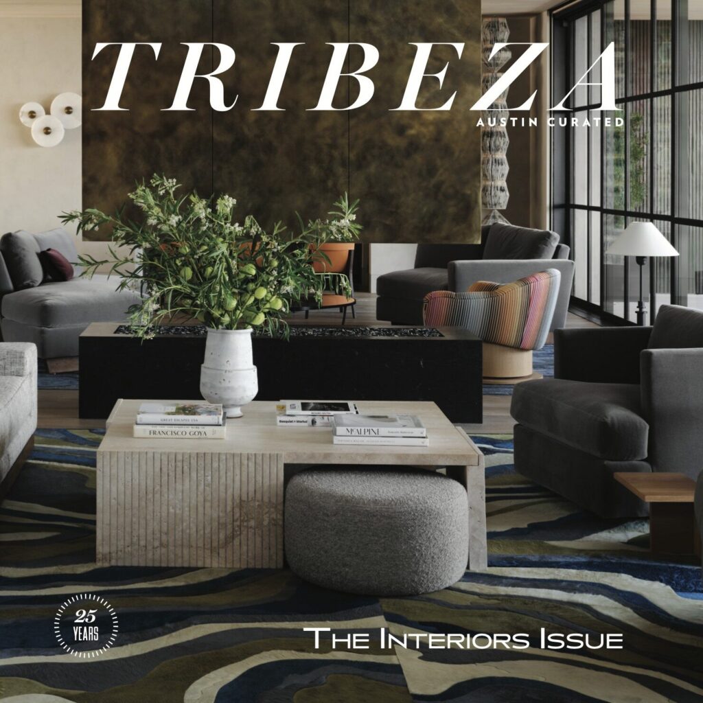 Modern living room with luxury designer rug, neutral furniture, and a silk rug centerpiece.