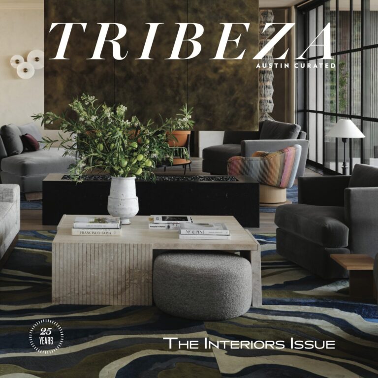 Modern living room with luxury designer rug, neutral furniture, and a silk rug centerpiece.