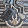Mika Hide 29748 luxury designer rug with abstract stripes, curves, and ovals in layered shades.