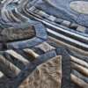 Close-up of Mika Hide 29748 luxury handmade hide rug in geometric designer pattern.