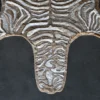 Luxury designer handmade hide rug with abstract zebra pattern on a dark backdrop.