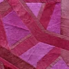 Vertigo Hide 15520 is a luxury handmade designer rug with abstract pink and purple geometric shapes and a textured hide surface.