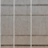 Close-up of a building facade with a beige grid pattern, echoing luxury designer rugs and high-end handmade wool textures.