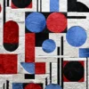 Luxury designer rug with geometric red, blue, black, and white shapes on textured hide.