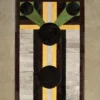 A luxury designer rectangular rug with geometric shapes in premium wool, silk, and hide.
