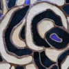 Bloom Hide 15106 is a luxury designer rug with an abstract mosaic of beige, black, and brown patches plus subtle purple accents.
