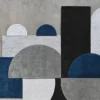 Luxury designer rug featuring abstract blue, gray, and black geometric shapes on a neutral backdrop.