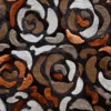 Luxury designer rug with abstract rose shapes in brown, white, and copper handmade hide patches.