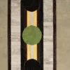 Luxury designer rug with three bold circles on a striped, high-end handmade wool background.
