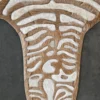 A close-up of Zebra Hide 16332 luxury designer hide rug with tan and white abstract stripes on a dark surface.