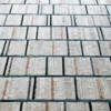 Boardwalk Hide 15546 luxury designer rug features textured white tiles in a high end handmade hide rug grid pattern.