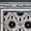 Close-up of luxury designer rug Aubusson Hide 15998 with intricate handmade patterns.