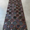 The Ignition Hide 27421 is a luxury designer rug with geometric patterns on concrete.