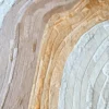 A close-up of Drift Hide 27681 luxury designer rug shows layered neutral hide strips, evoking high end handmade rugs with topographic contours.
