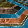 Luxury custom hide rug with a geometric pattern in teal, brown, green, and tan.