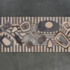 Abstract wooden sculpture echoing geometric patterns found in luxury designer rugs on display.