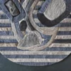 The Mika Hide 29748 luxury designer rug showcases an abstract, high-end hide pattern with gray, blue, and beige on a dark floor.