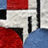 A close-up of a luxury designer rug featuring geometric patterns on textured custom hide.