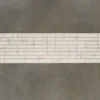 Rectangular white tile mosaic evokes luxury designer rugs with a modern, high-end pattern.