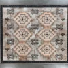 Winterlude Hide 26667 luxury designer rug with geometric star motifs in beige, brown, and gray.