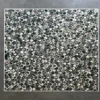 Luxury designer rug featuring a geometric semicircle motif in green, gray, and white.