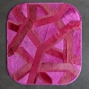The Vertigo Hide 15520 is a luxury designer rug with a handmade hide, pink and magenta abstract pattern, on a gray floor.