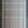 Luxury custom handmade silk and wool designer rug with geometric beige pattern.