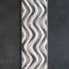 Flow Hide 29576 designer rug features wavy gray, white, and beige bands on a luxury handmade hide rug panel.