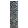A tall, narrow designer rug panel with a hexagonal grid pattern and luxe metallic accents.