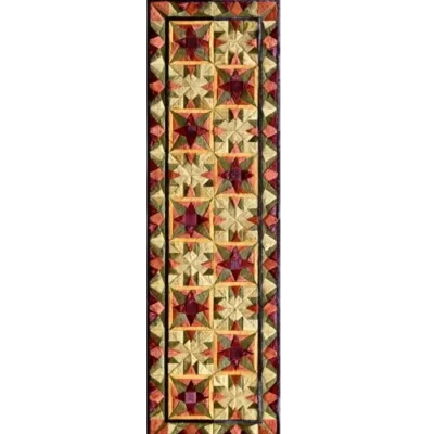 The Fancy Hide 16177 is a handmade designer hide rug with quilted star patterns in luxury red, yellow, and brown on black.