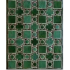 Luxury designer rug with green squares, circles, and stars in a metallic grid pattern.